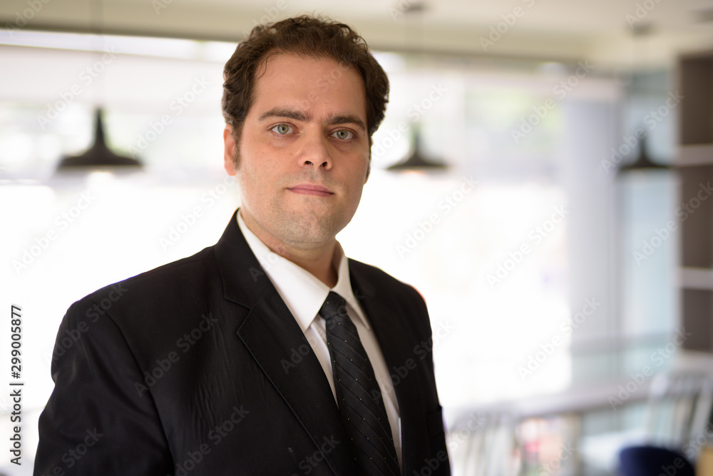 Portrait of Iranian businessman relaxing at home Portrait of Iranian businessman relaxing at home