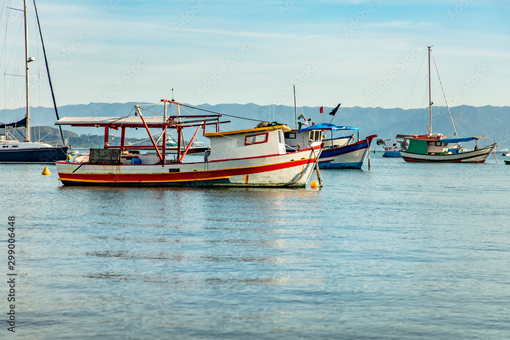 Boats in Sao Paulo coast on a beach in Ilhabela island, Brazil coast boat