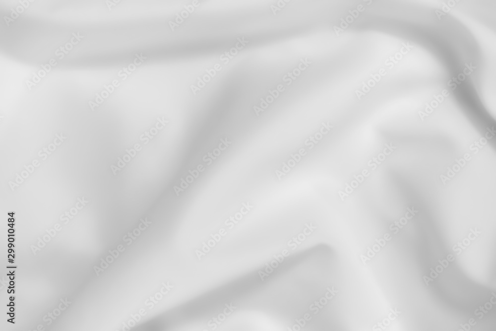 Abstract white fabric texture background. Cloth soft wave. Creases of satin, silk, and cotton.