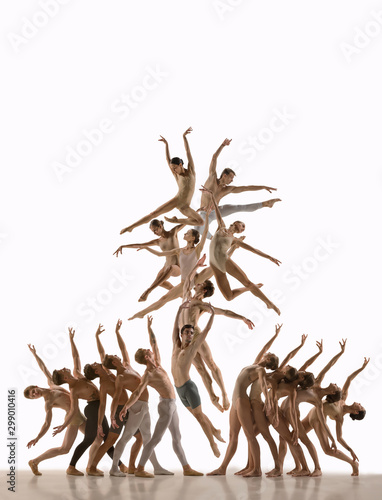 The group of modern ballet dancers. Contemporary art ballet. Young flexible athletic men and women in tights. Negative space. Concept of dance grace, inspiration, creativity. Made of shots of 11