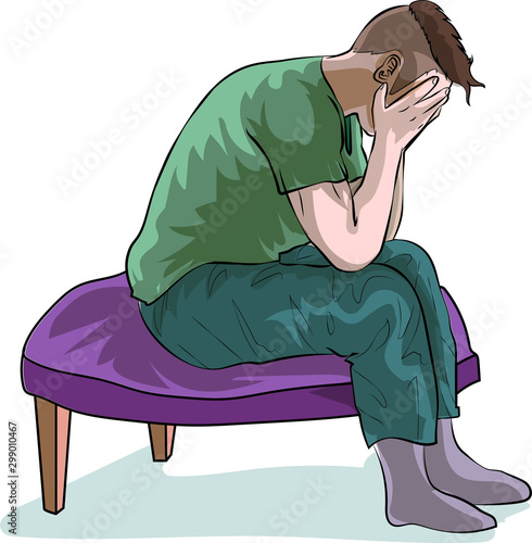 The young man siting sadly bowing down on the chair.