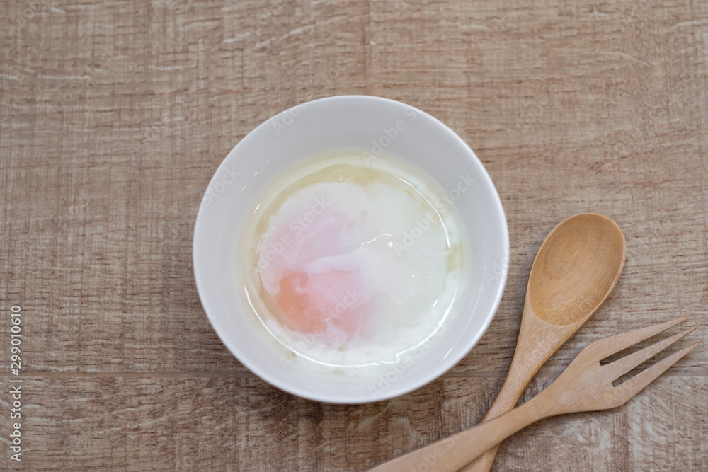 Soft boiled egg for breakfast on wooden table, Japanese onsen egg Soft boiled egg for breakfast on wooden table, Japanese onsen egg