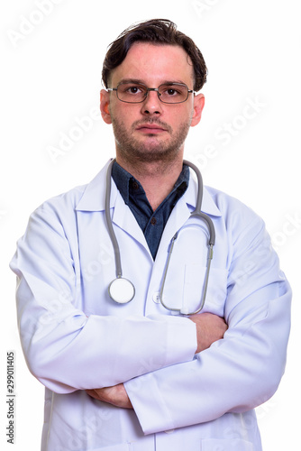 Close up of young man doctor with arms crossed © Ranta Images