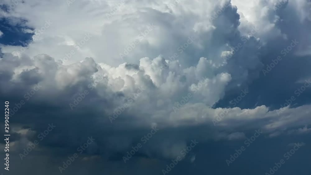 Passing white cumulus clouds blue dark sky storm time lapse Passing white cumulus clouds blue dark sky storm time lapse
