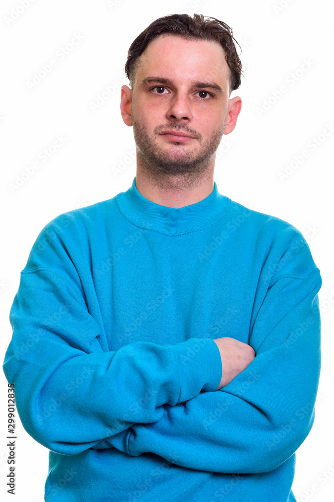 Obraz premium Studio shot of young man with arms crossed