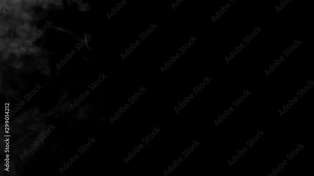 The smoke motion isolated on black background ,slow motion movement The smoke motion isolated on black background ,slow motion movement