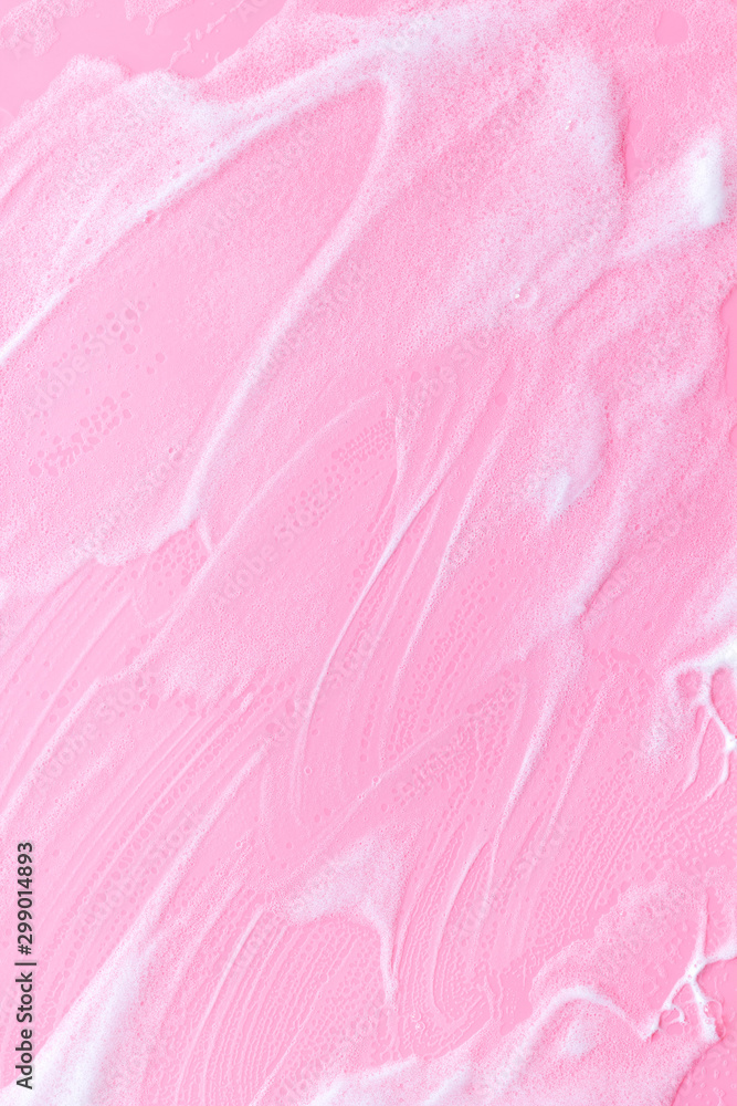 Fototapeta premium Foam backgroud on pink table top view copy space