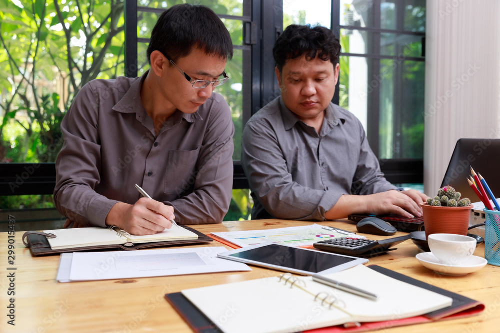 Small and Medium Enterprise Business concept of ,Businessman discussing investment plan with his partner in office. Small and Medium Enterprise Business concept of ,Businessman discussing investment plan with his partner in office.