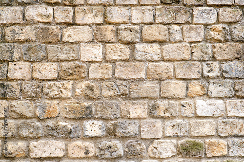 Background from a rough brown natural stone wall