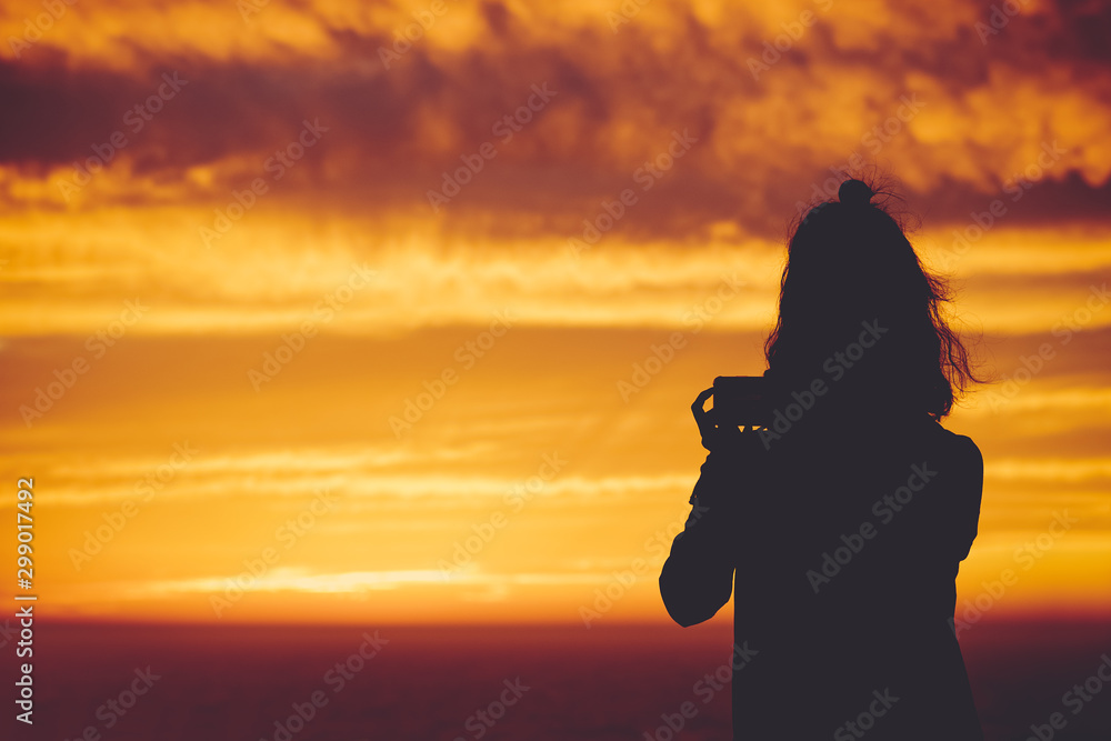 traveler with golden sunset sky