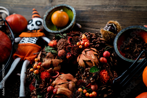 Halloween theme. Decorations prepared for Halloween on the rustic wooden table. Place for text.