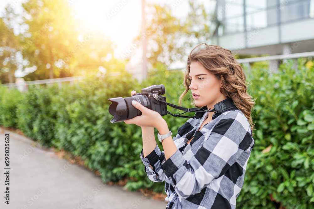 Serious girl in plaid shirt looking at her camera. Serious girl in plaid shirt looking at her camera.