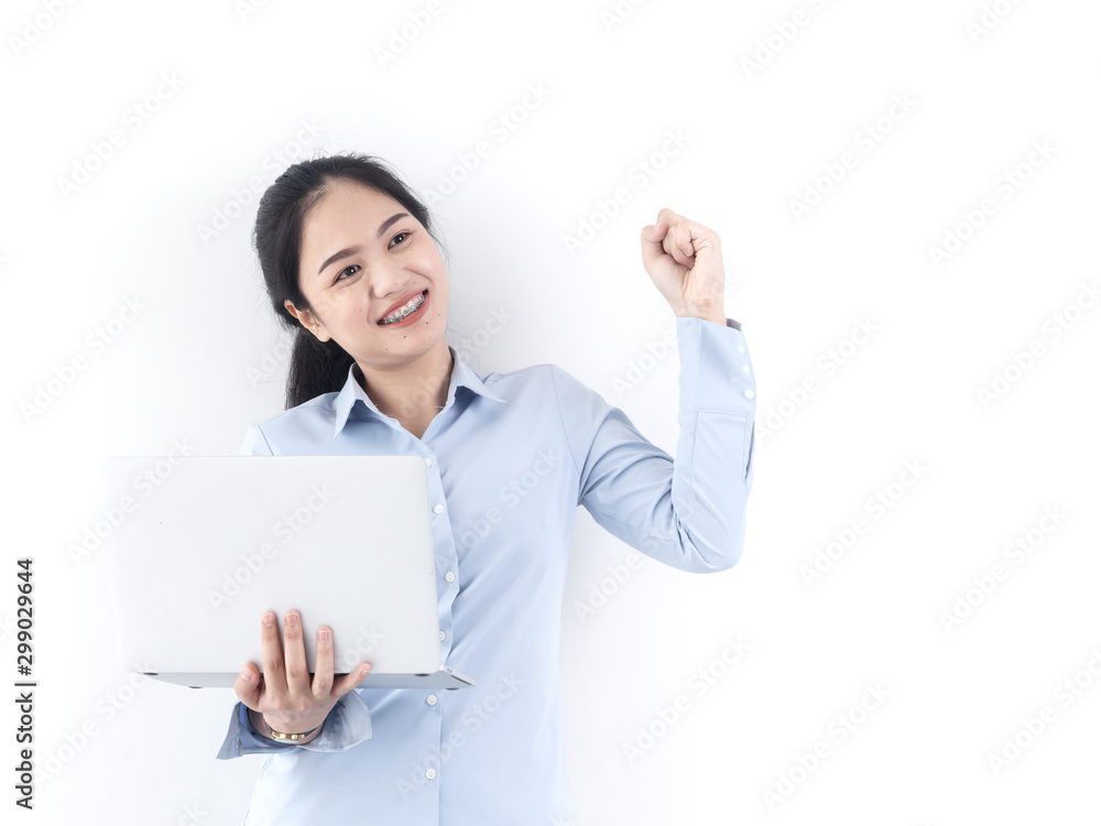 Happy Asian woman using laptop with white wall,lifestyle concept. Happy Asian woman using laptop with white wall,lifestyle concept.