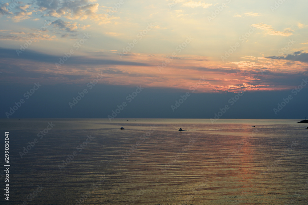 Sunrise over the sea in the early morning near the coast of Sicily, Italy