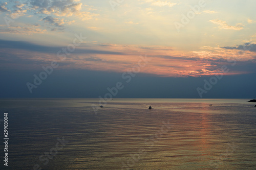 Sunrise over the sea in the early morning near the coast of Sicily, Italy