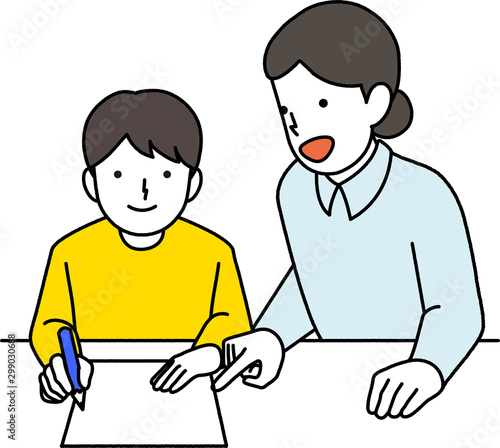 先生に勉強を教えてもらう男の子