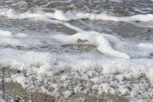 Natural background with foam on water surface