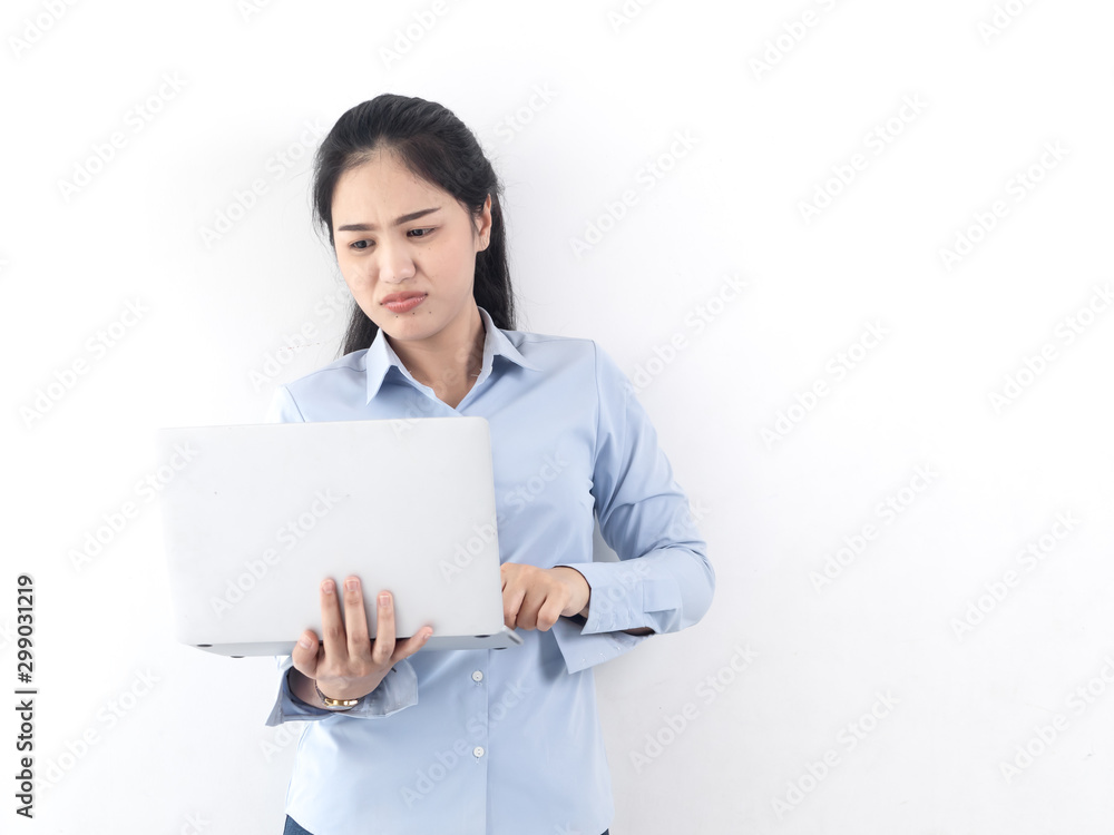 Happy Asian woman using laptop with white wall,lifestyle concept. Happy Asian woman using laptop with white wall,lifestyle concept.