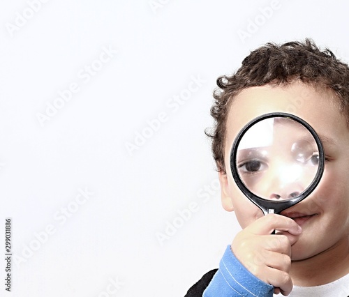 boy with magnifying glass ready to explore stock photo