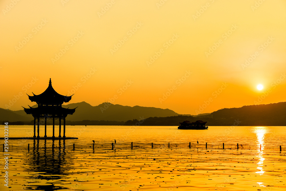 The beautiful of silhouette sunset landscape scenery of Xihu West Lake and pavilion in Hangzhou CHINA.