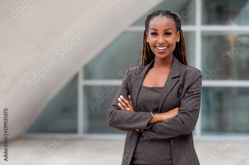 Cheerful smiling businesswoman portrait, happy african american corporate executive at work photo