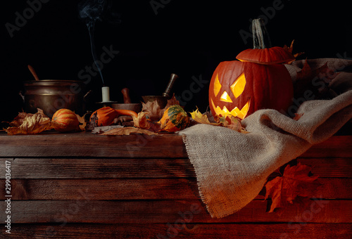Halloween pumpkins on a old wooden background. Conceptual still life on the theme of Halloween.