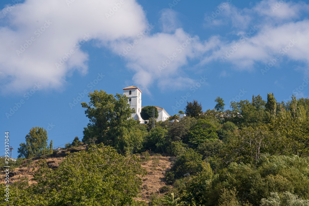 Bubion church tower in the Poqueira ravine Bubion church tower in the Poqueira ravine