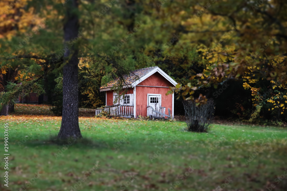 Loviisa, Finland - 7 October 2019: Small wooden house at the Manor House Malmgard. Loviisa, Finland - 7 October 2019: Small wooden house at the Manor House Malmgard.