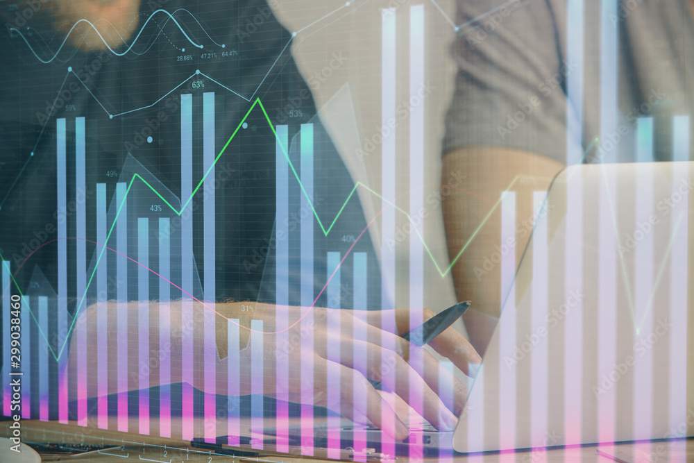 Forex graph with businessman typing on computer in office on background. Concept of analysis. Double exposure. Forex graph with businessman typing on computer in office on background. Concept of analysis. Double exposure.