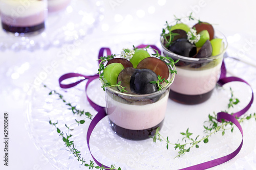Homemade autumn glass desserts with grapes
