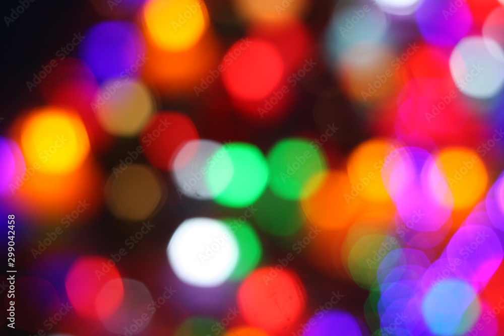 Fototapeta premium Blurry image of colorful bokeh at a decorating light during festival.