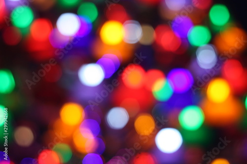 Blurry image of colorful bokeh at a decorating light during festival.