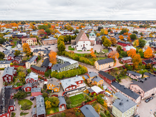 Aerial autumn view of Old town of Porvoo, Finland. Beautiful city landscape with idyllic river Porvoonjoki, old colorful wooden buildings and Porvoo Cathedral. photo