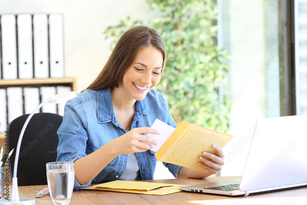 Happy entrepreneur putting document in an envelope Happy entrepreneur putting document in an envelope