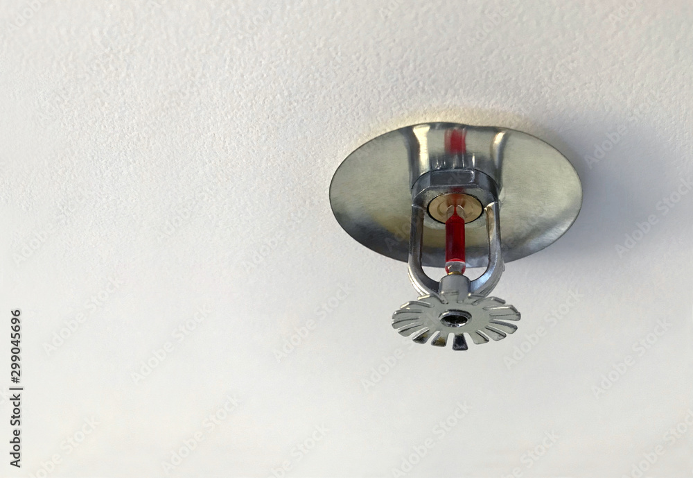 Fire sprinkler head on ceiling. Automatic fire extinguishing device