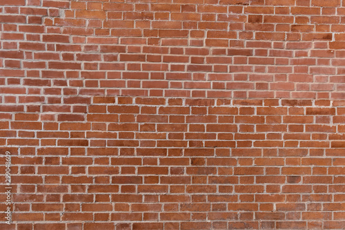 texture of old red brick wall with white seams