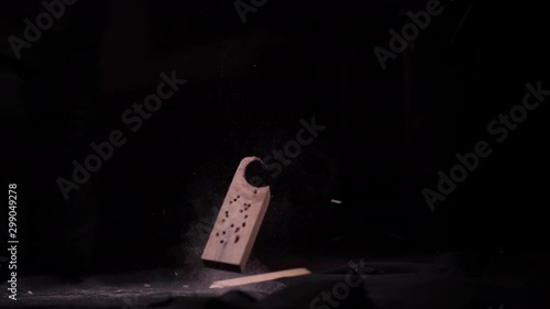 Old Dusty Scrap Wood Falling on the Ground in Black Studio (Shot 1 of 2)