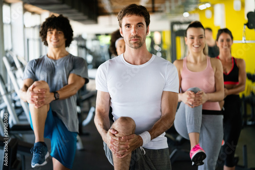 Picture of cheerful fitness team people in gym