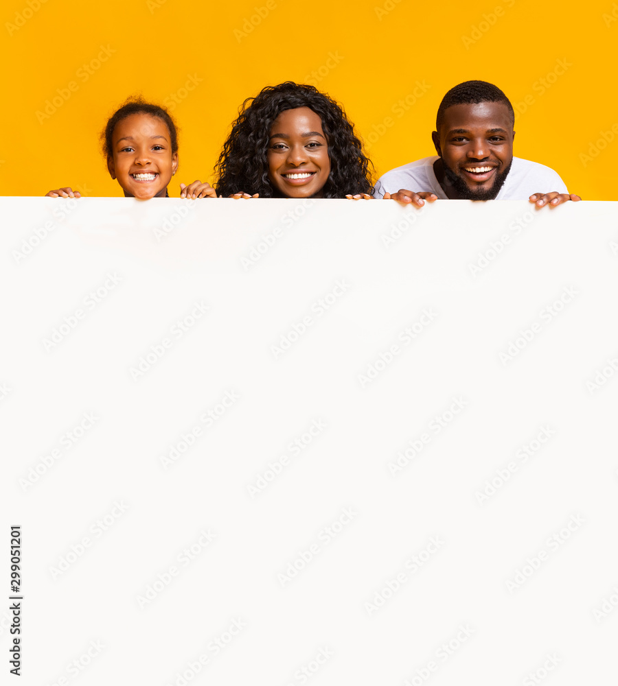 African american family leaning on blank white adverticement board African american family leaning on blank white adverticement board