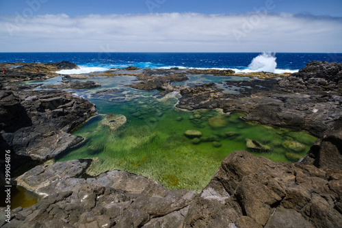 Los Charcones area with beautiful green and blue pools of sea water photo