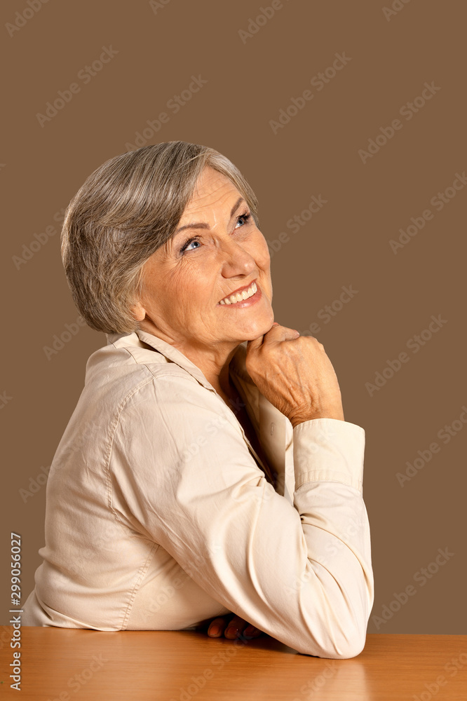 portrait of happy senior woman at table portrait of happy senior woman at table