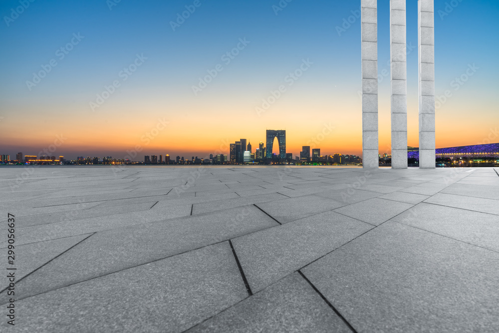 Panoramic skyline and buildings with empty square floor at dusk Panoramic skyline and buildings with empty square floor at dusk