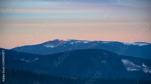 Landscape with Beautiful Sunset in Winter Mountains.