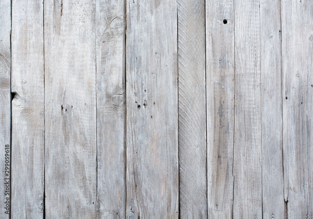 Naklejka premium Old wooden boards painted with gray paint. Abstract background.