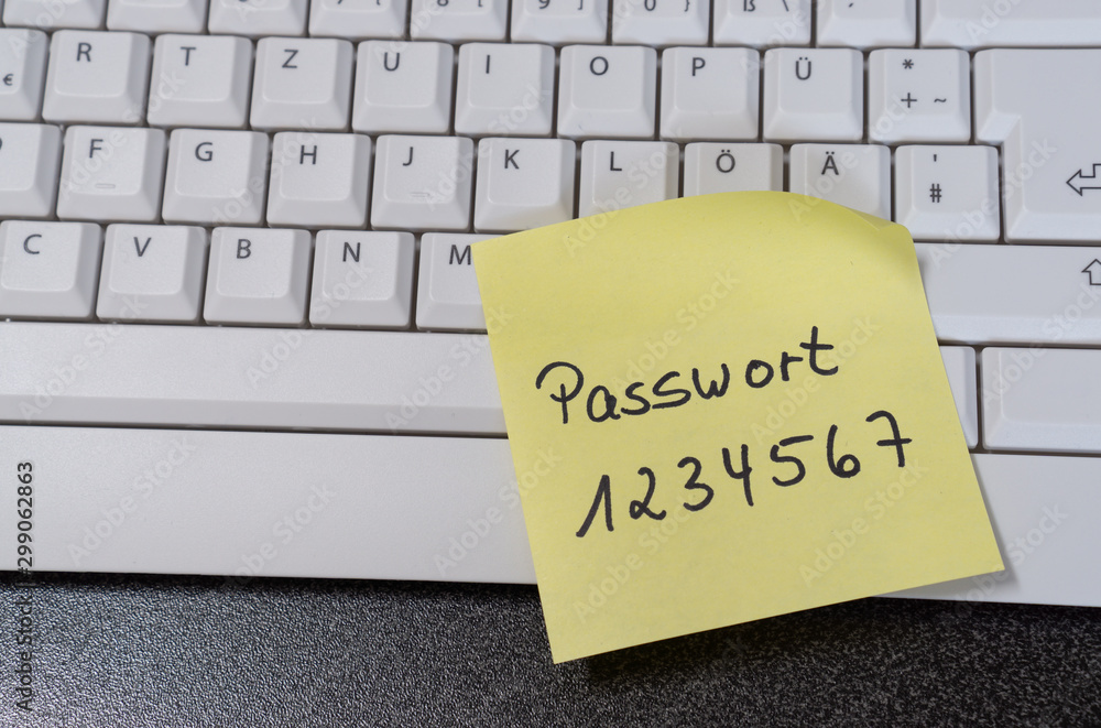 Note with the german word for password on a computer keyboard - obrazy, fototapety, plakaty 