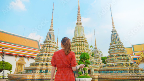 Tourist woman is traveling and sightseeing at Wat Pho in Bangkok  Thailand.