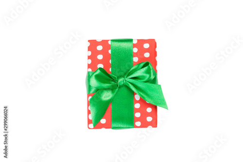 Christmas or other holiday handmade present in red paper with Green ribbon. Isolated on white background  top view. thanksgiving Gift box concept