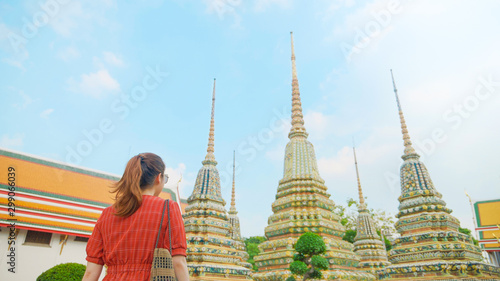 Tourist woman is traveling and sightseeing "Wat Pho" temple in Bangkok, amazing Thailand. Traveling concepts.