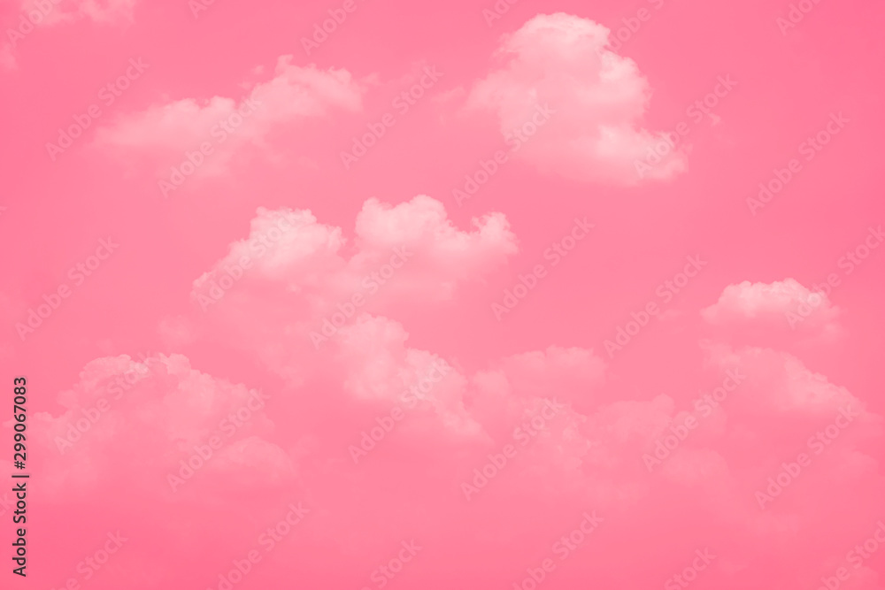 Fototapeta premium Pink sky background with white clouds.