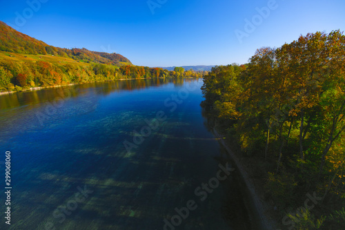 The river Rhine, only a few hundred meters young, after leaving Lake Constance. Autumn. Near the Swiss town Stein am Rhein. View from the car bridge to the west, the road leads to the Rhine Falls.